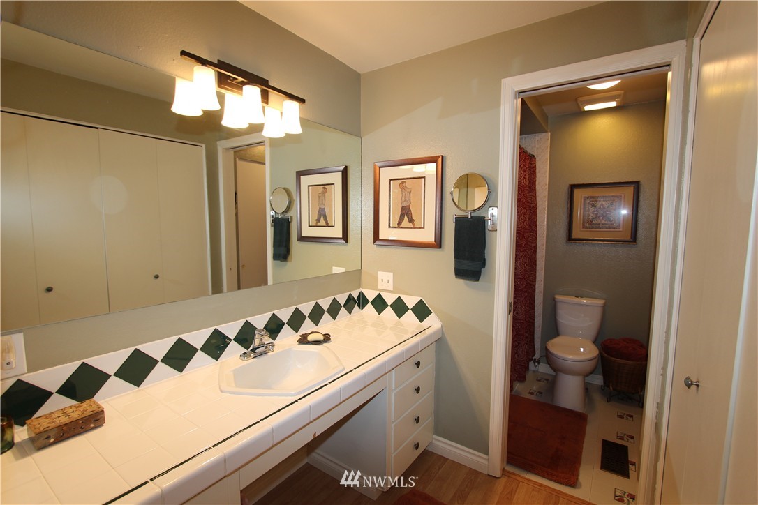 320 170th Place Southwest Bothell, WA 98012 - Photo 11 of 25 a bathroom with a sink and a mirror