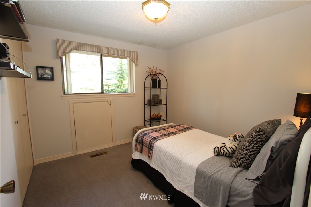 320 170th Place Southwest Bothell, WA 98012 - Photo 12 of 25 a bedroom with a bed and a window