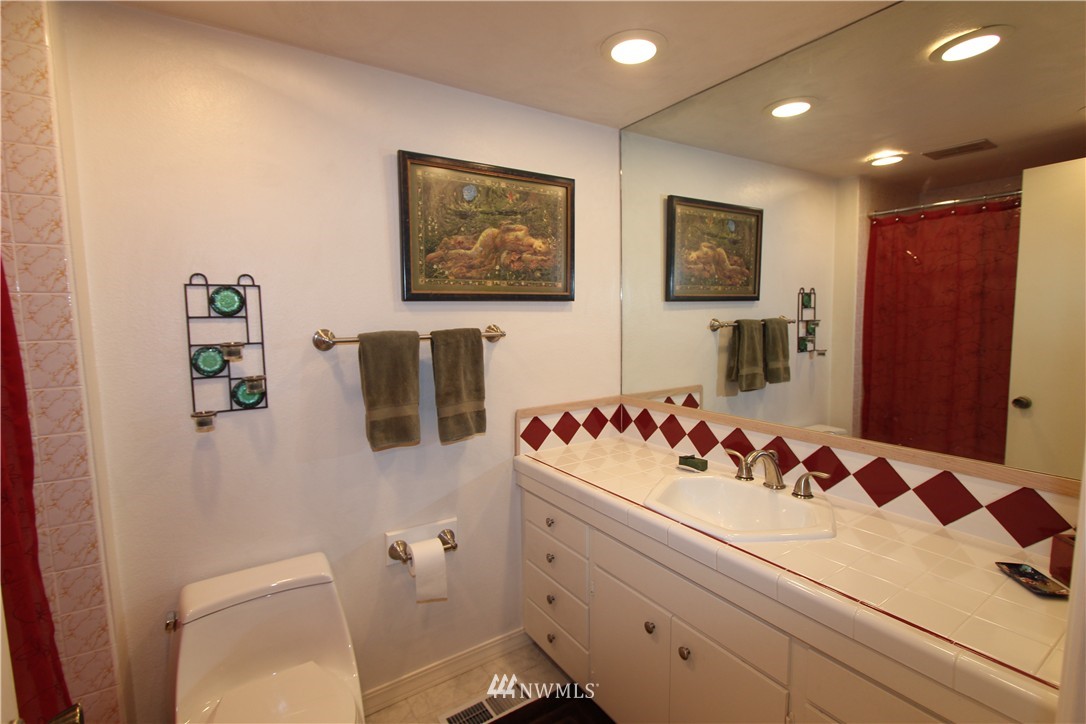 320 170th Place Southwest Bothell, WA 98012 - Photo 13 of 25 a bathroom with a sink mirror vanity and toilet
