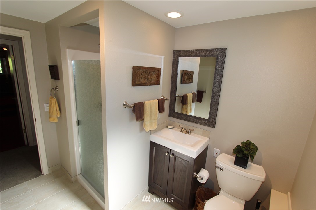 320 170th Place Southwest Bothell, WA 98012 - Photo 15 of 25 a bathroom with a toilet sink and mirror