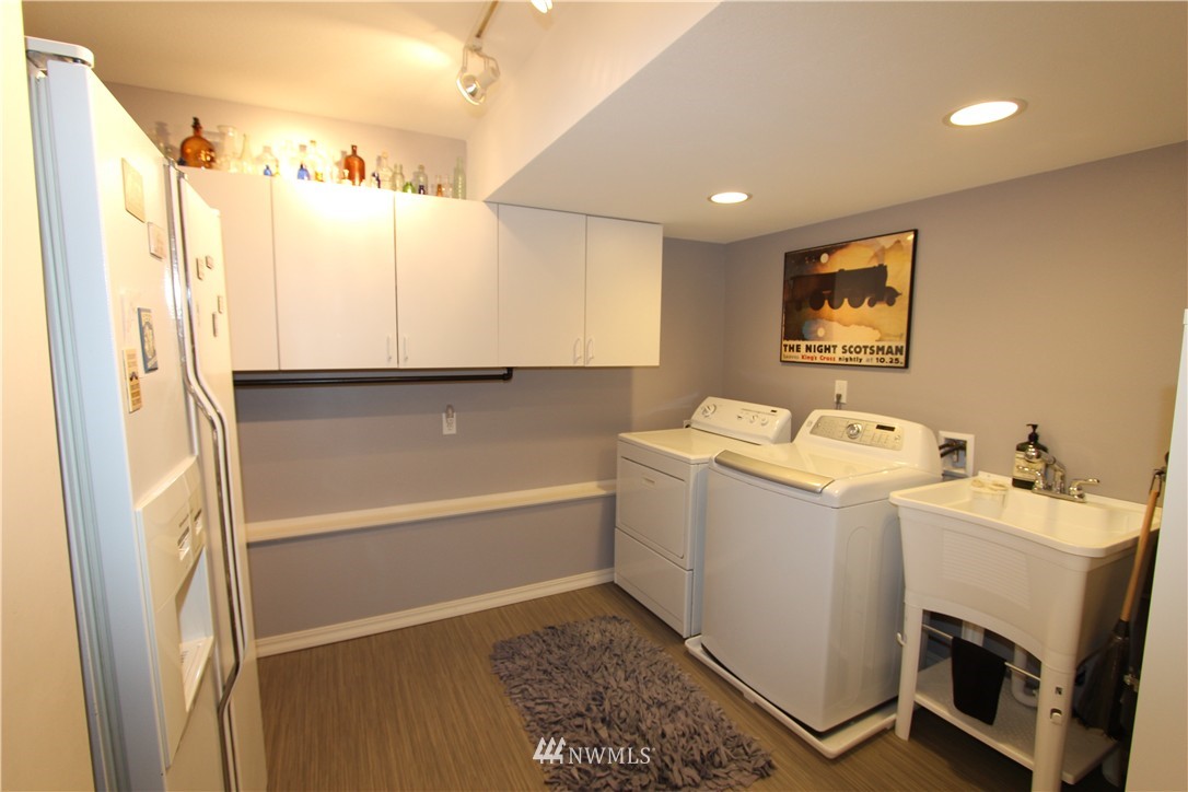 320 170th Place Southwest Bothell, WA 98012 - Photo 17 of 25 a bathroom with a sink a bathtub and a window