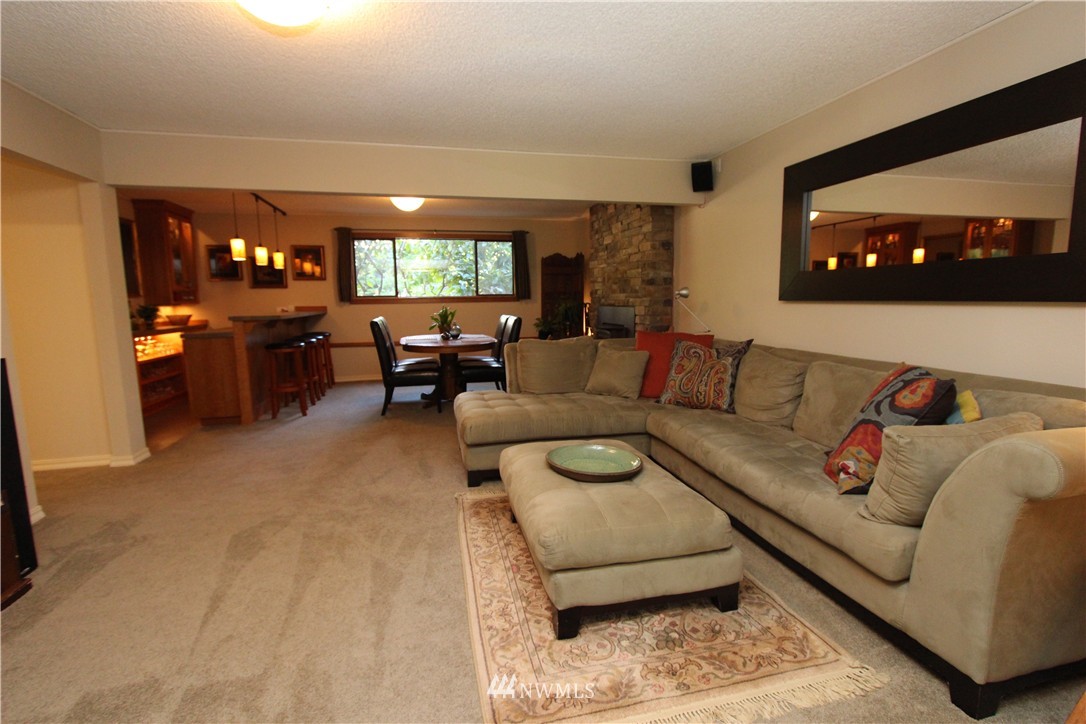 320 170th Place Southwest Bothell, WA 98012 - Photo 3 of 25 a living room with furniture and a large window