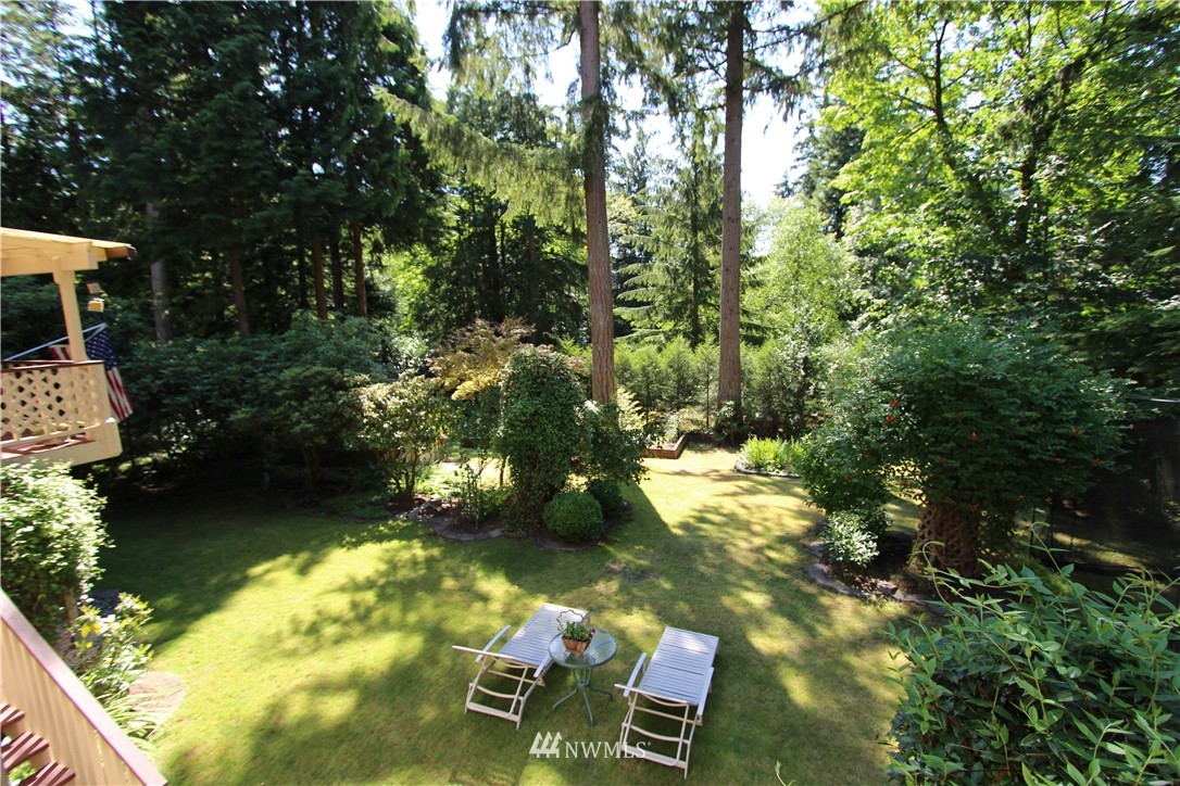 320 170th Place Southwest Bothell, WA 98012 - Photo 21 of 25 a backyard of a house with yard and outdoor seating