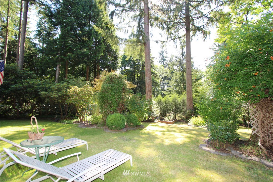 320 170th Place Southwest Bothell, WA 98012 - Photo 22 of 25 a view of a backyard with swimming pool