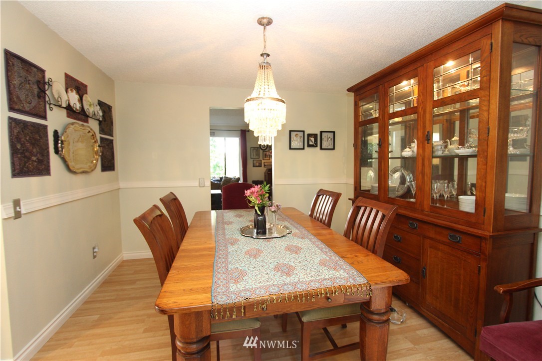 320 170th Place Southwest Bothell, WA 98012 - Photo 7 of 25 a view of a dining room with furniture and window