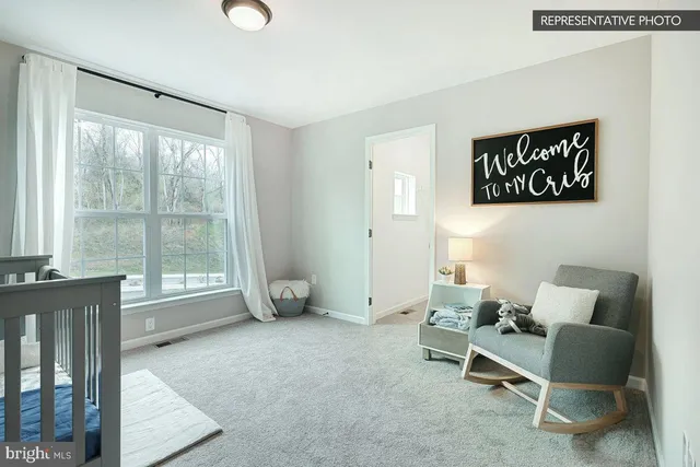 a view of workspace with furniture and window