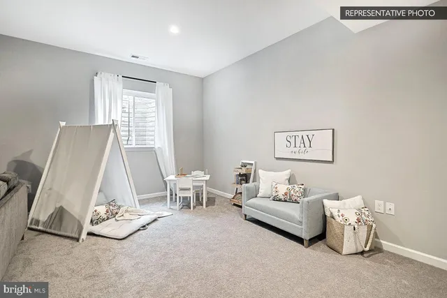 a living room with furniture a window and a table