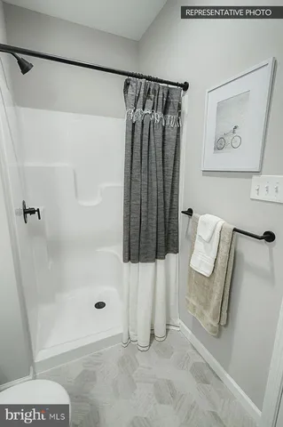 a bathroom with a shower and a toilet