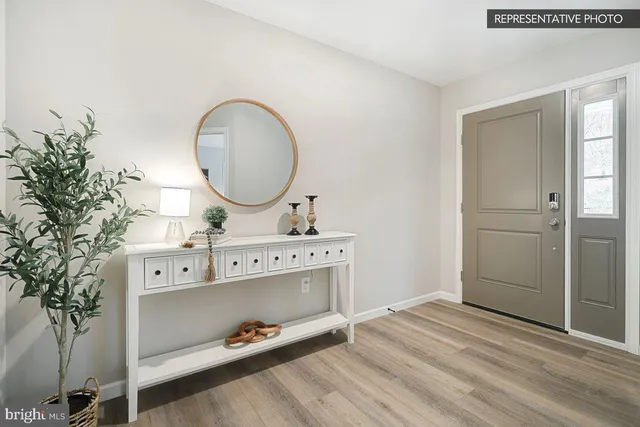 a bathroom with a sink mirror and vanity
