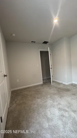 an empty room with a natural light