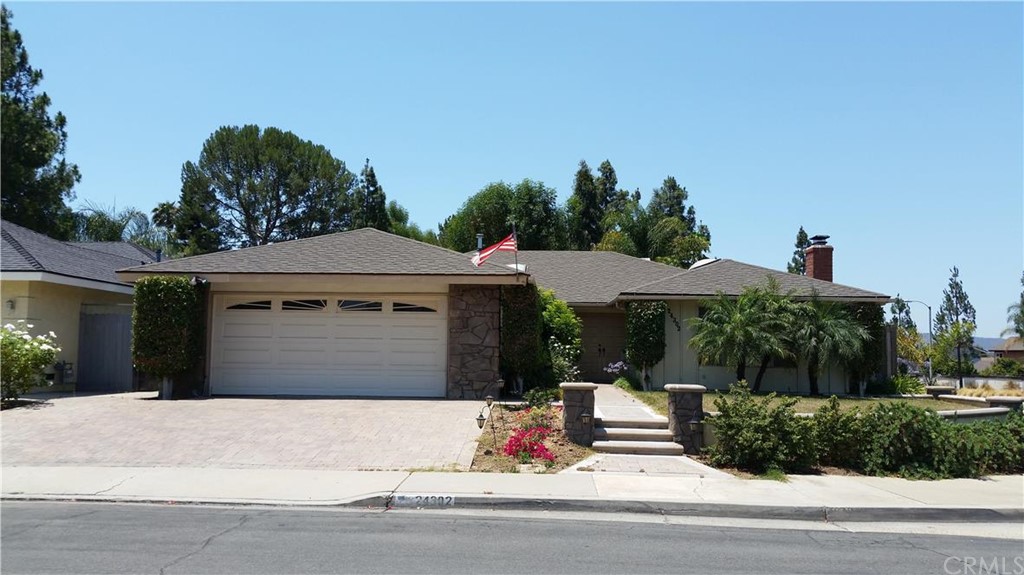 24302 Blueridge Road Lake Forest, CA 92630 - Photo 1 of 1 Paver stone driveway, stone pillars, and nicely landscaped.