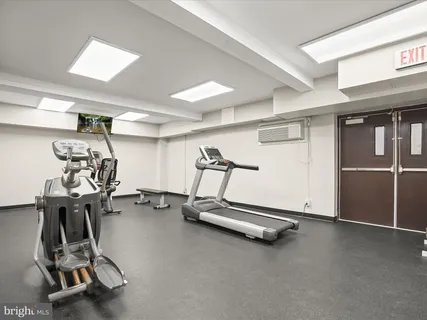 a view of a patio with table and chairs with wooden fence and plants