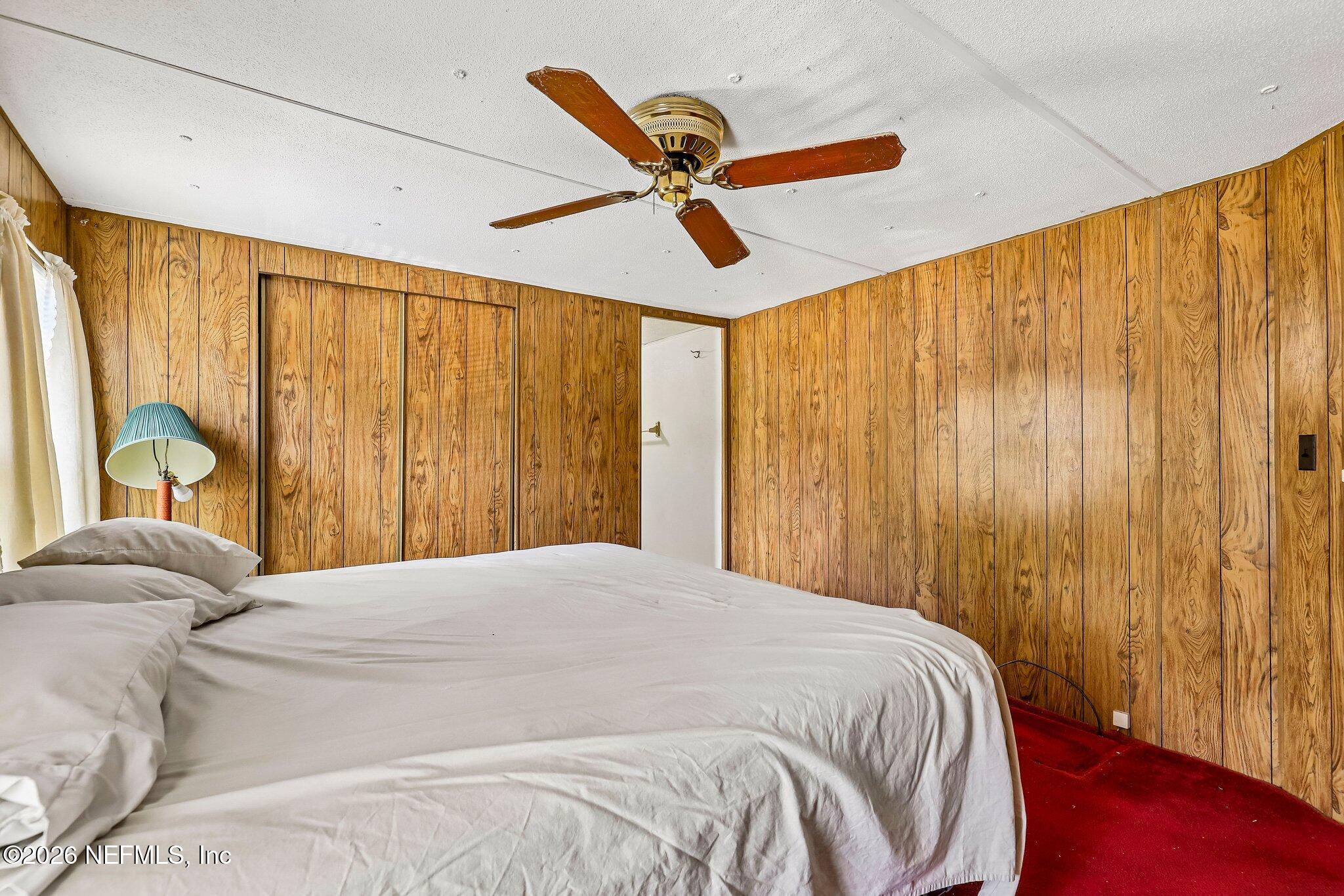 9690 Black Jack Road Macclenny, FL 32063 - Photo 23 of 34 a bedroom with a bed and a window