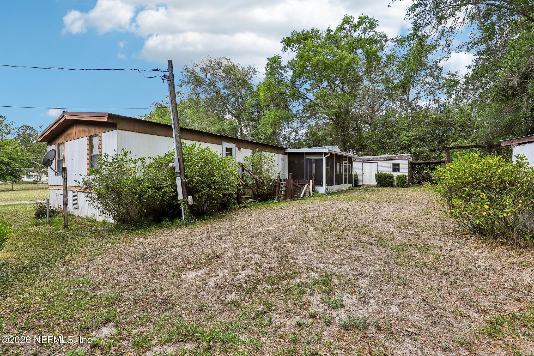 9690 Black Jack Road Macclenny, FL 32063 - Photo 28 of 34 a front view of a house with garden