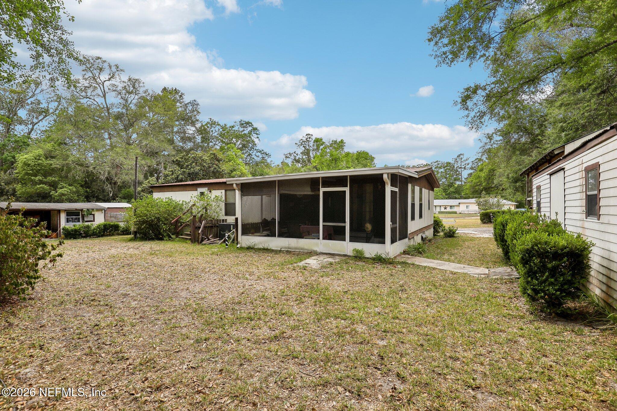 9690 Black Jack Road Macclenny, FL 32063 - Photo 29 of 34 a view of a house with backyard and garden