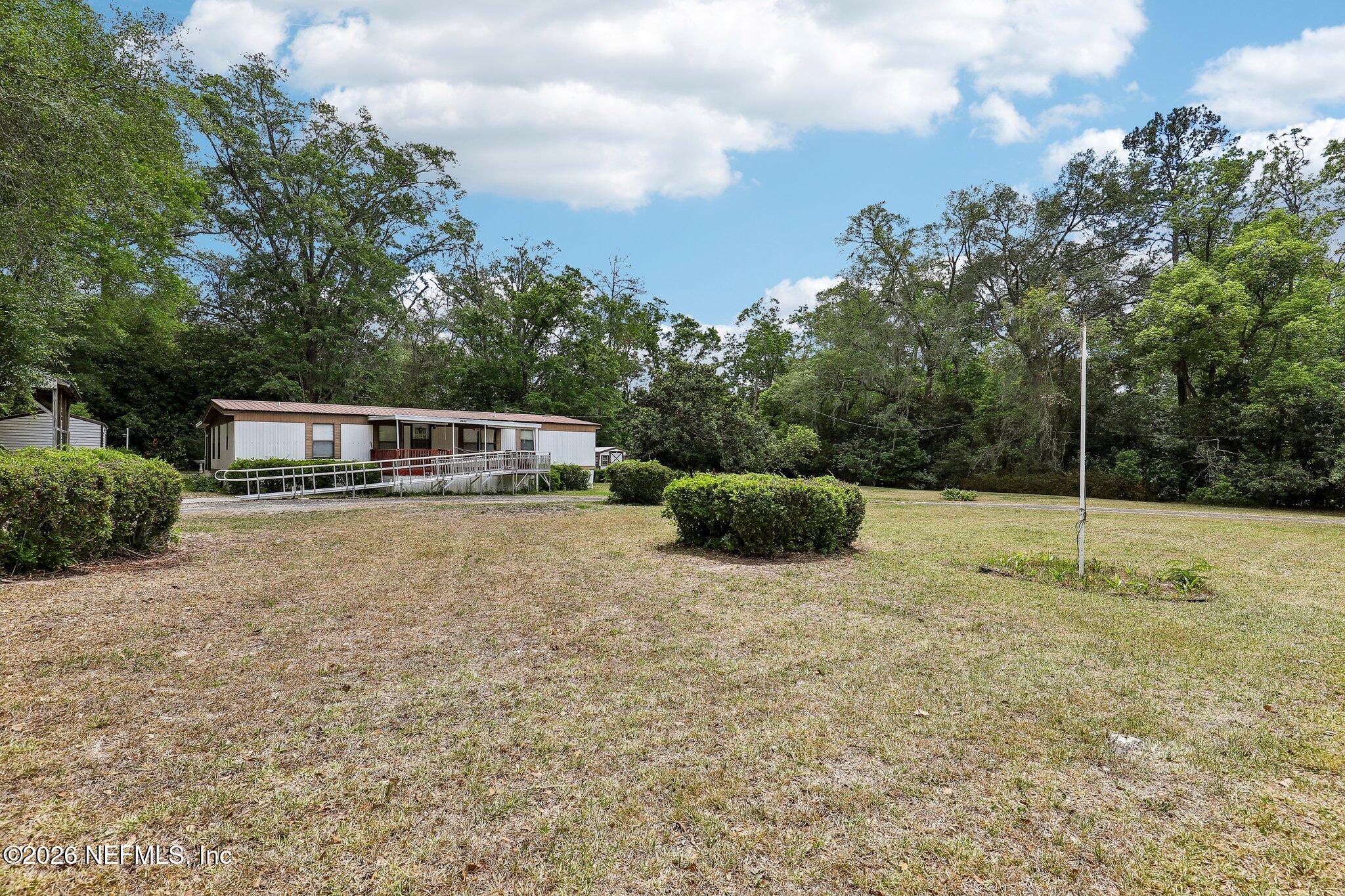 9690 Black Jack Road Macclenny, FL 32063 - Photo 3 of 34 a house view with a outdoor space