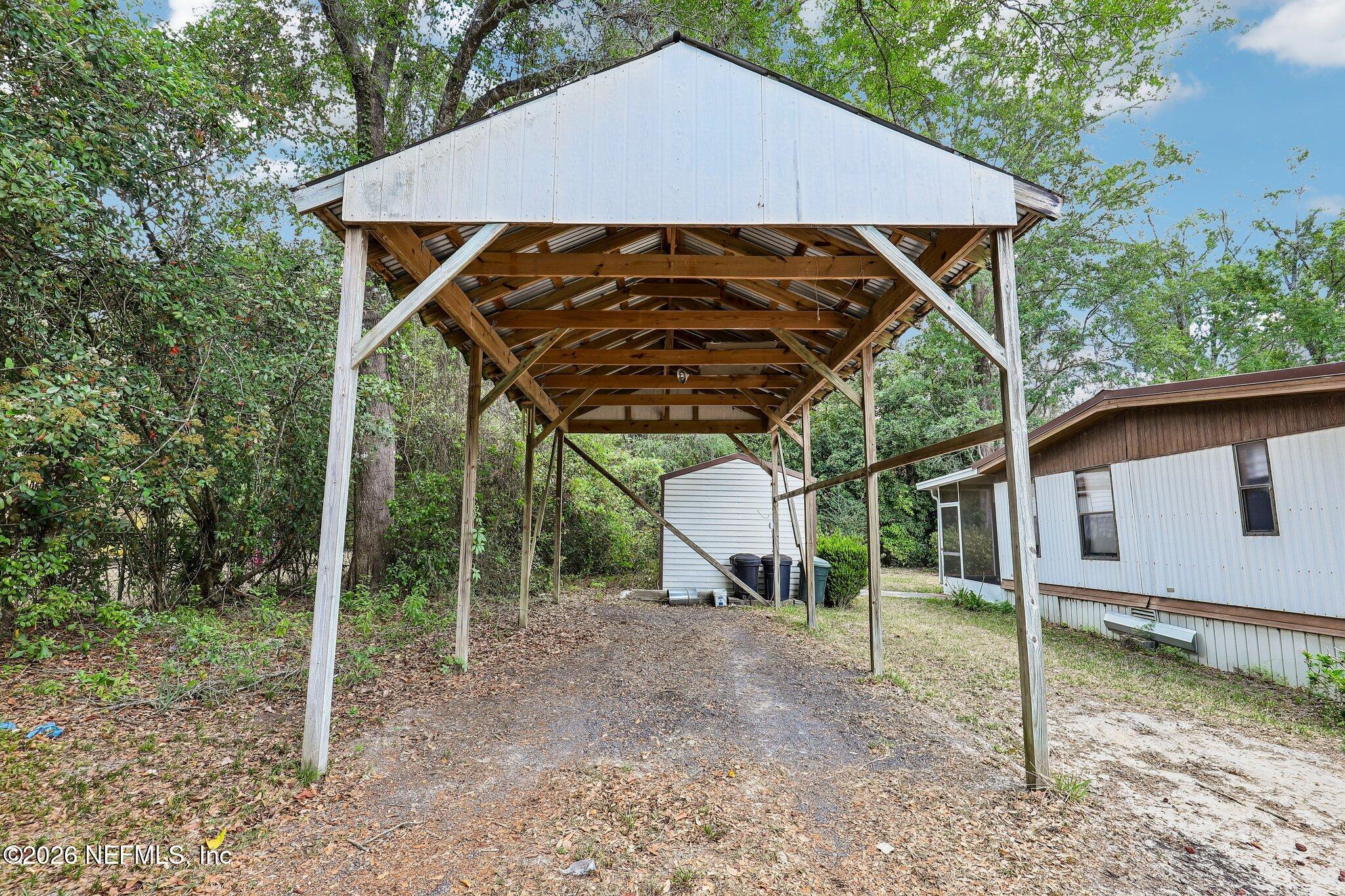9690 Black Jack Road Macclenny, FL 32063 - Photo 31 of 34 a view of wooden house with backyard