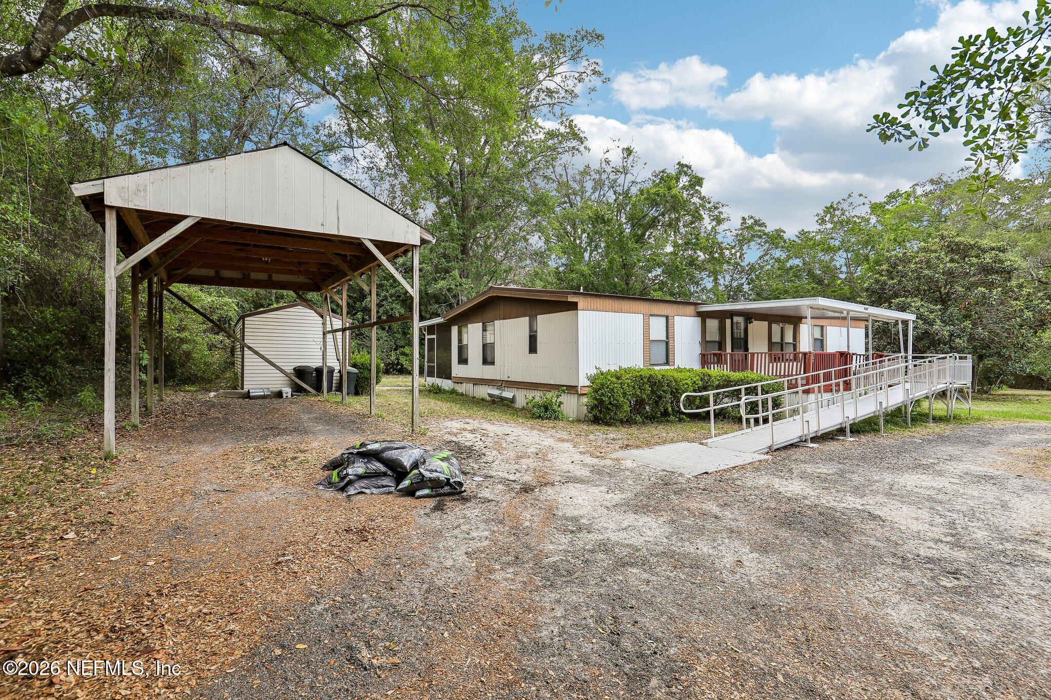 9690 Black Jack Road Macclenny, FL 32063 - Photo 32 of 34 a house view with a garden space