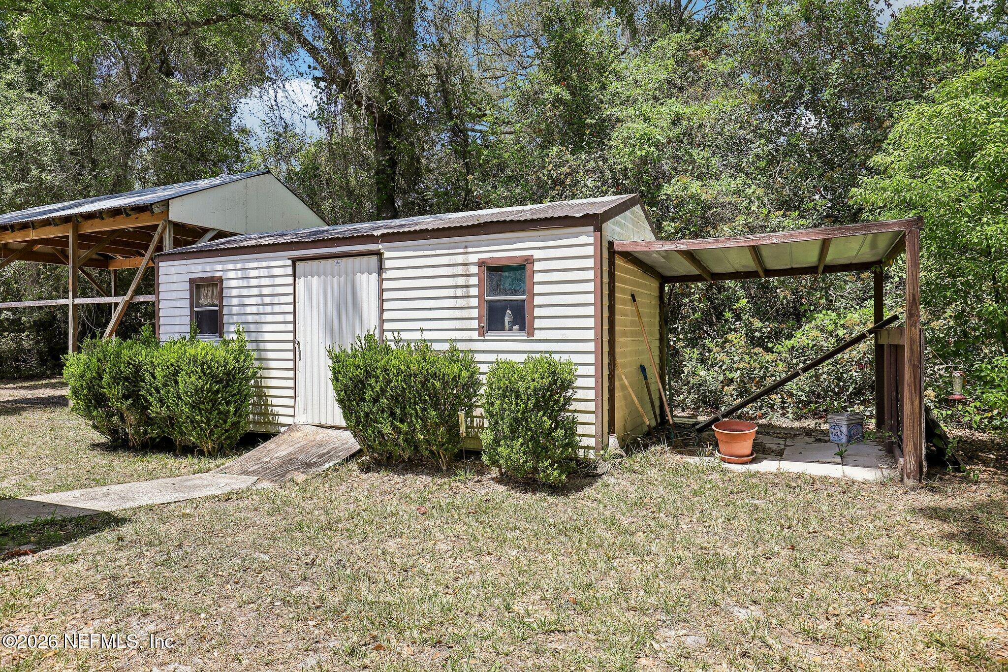 9690 Black Jack Road Macclenny, FL 32063 - Photo 33 of 34 a view of a house with a yard