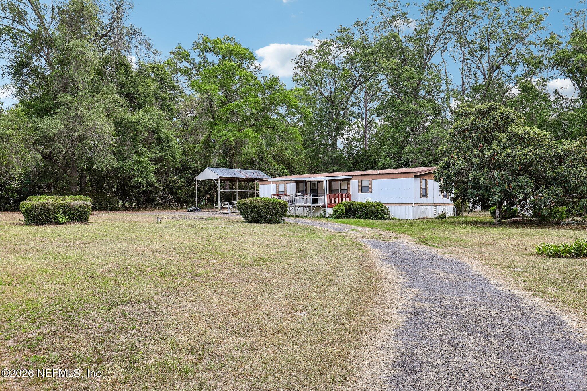 9690 Black Jack Road Macclenny, FL 32063 - Photo 4 of 34 a house view with a outdoor space