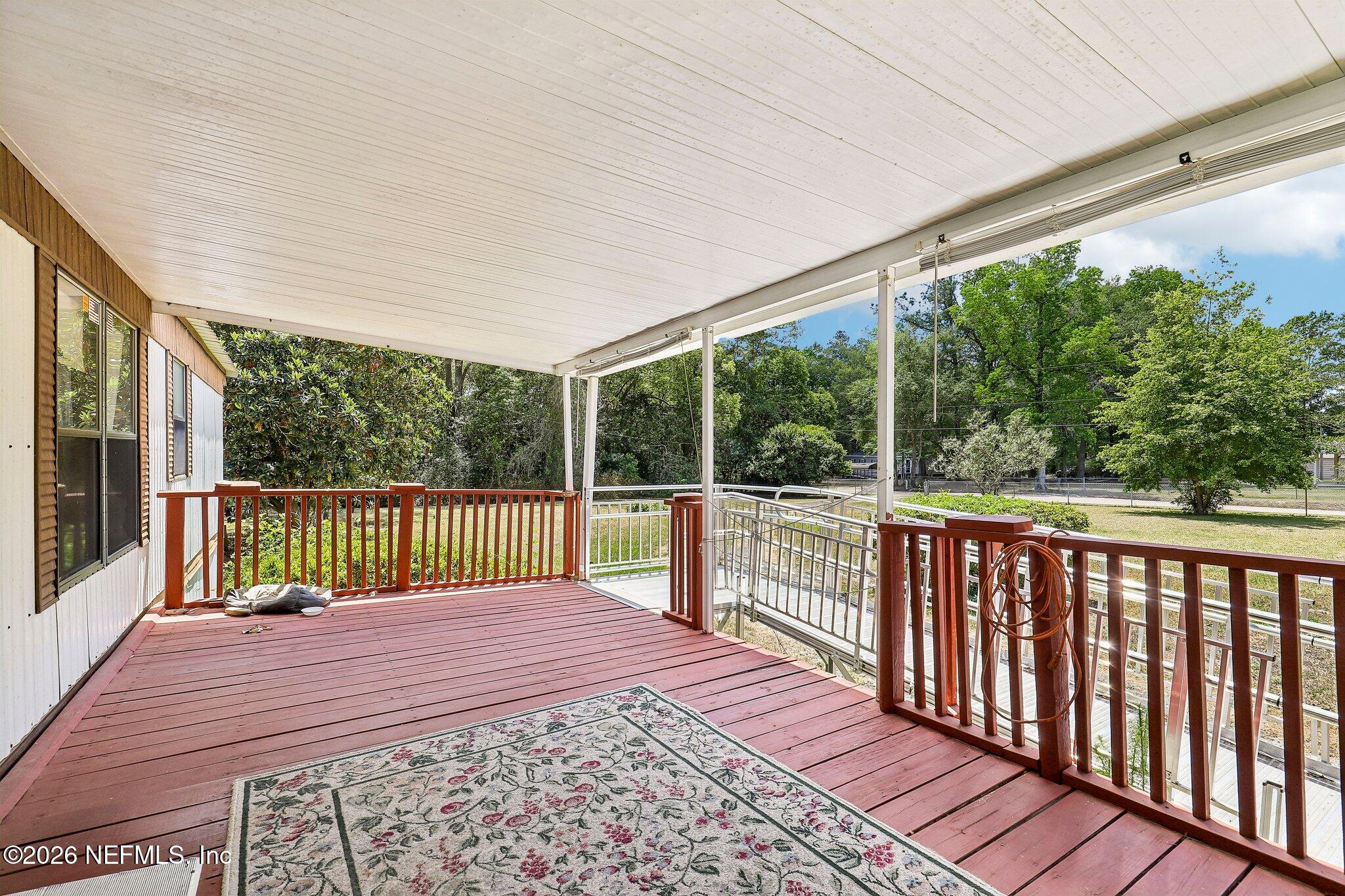 9690 Black Jack Road Macclenny, FL 32063 - Photo 7 of 34 a view of balcony with wooden floor