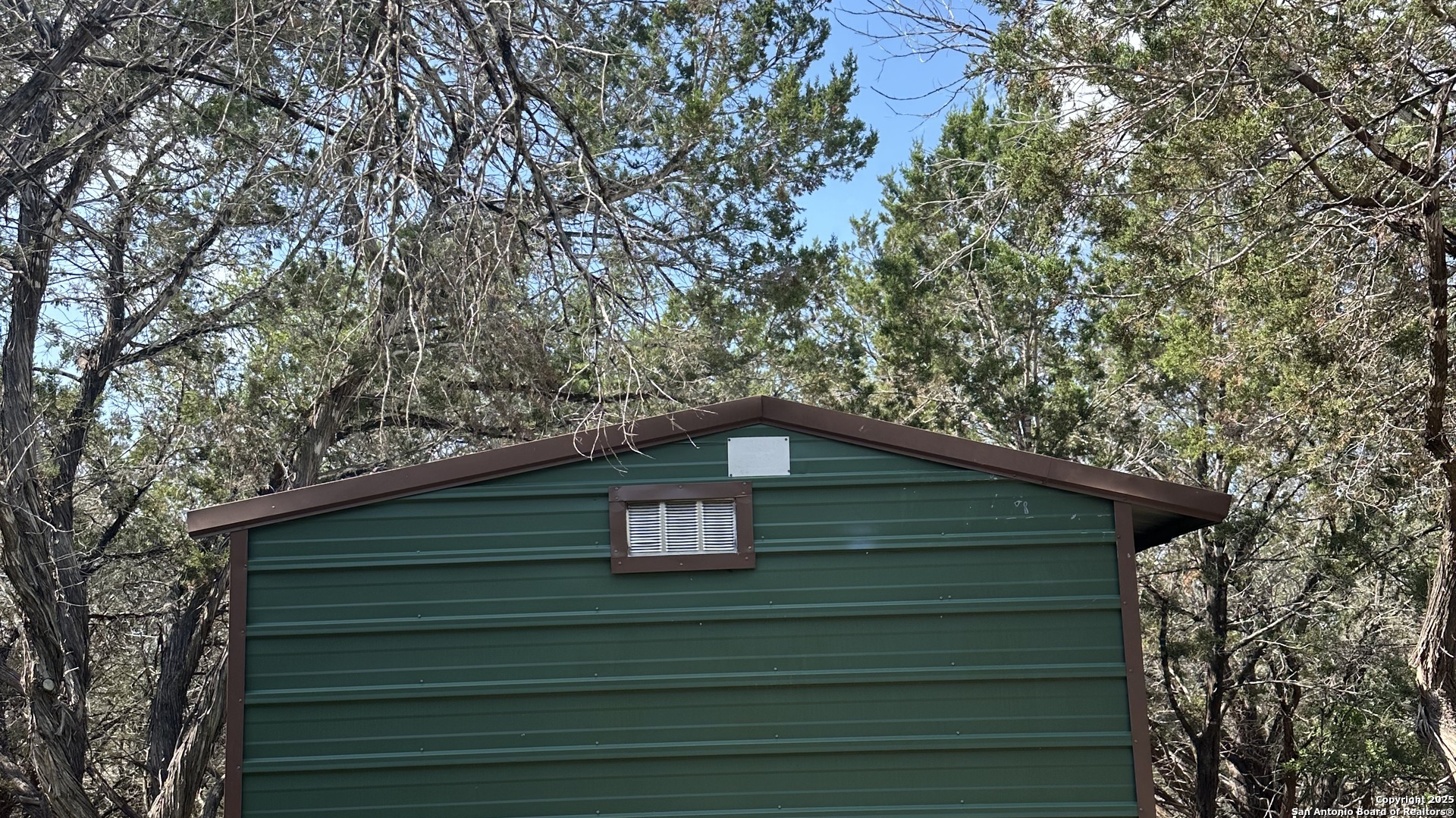 a view of a house with a small yard