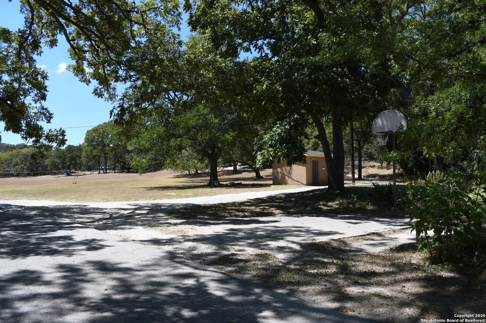 121 Agarita Drive Spring Branch, TX 78070 - Photo 17 of 23 a view of a house with a yard