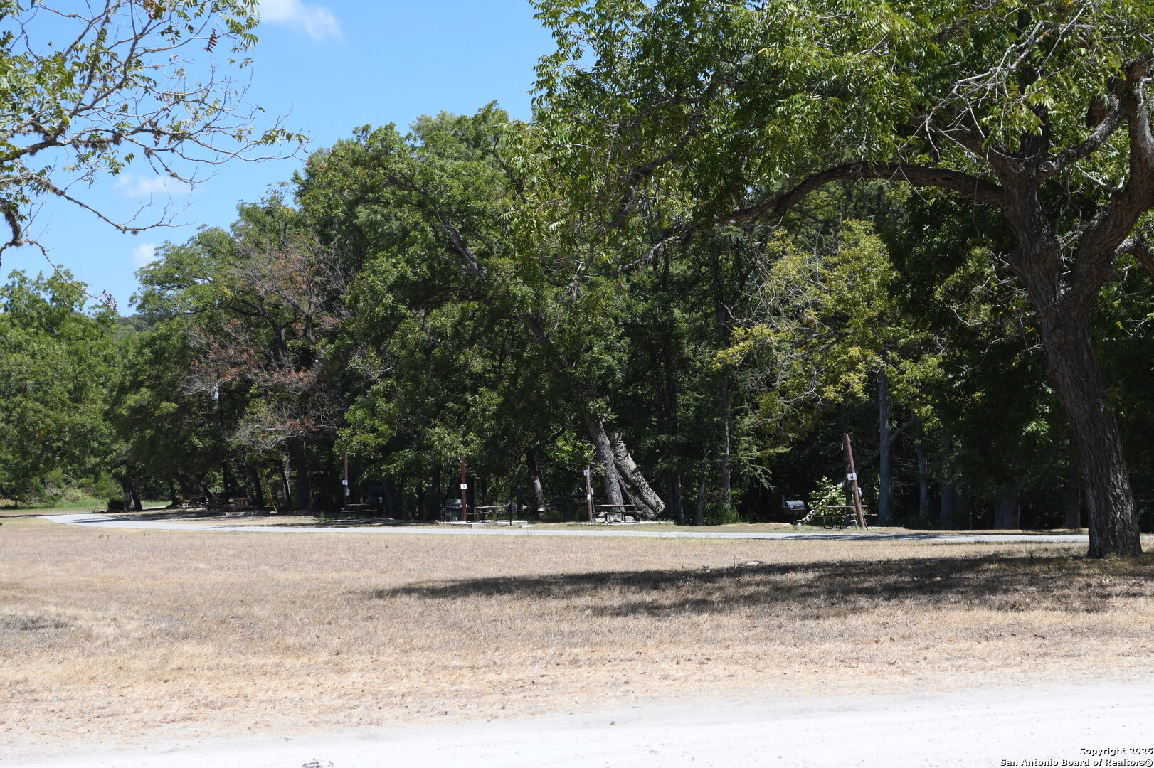 121 Agarita Drive Spring Branch, TX 78070 - Photo 10 of 23 a view of a yard with a barn