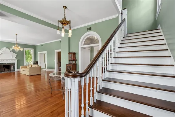 a view of entryway dining room and hall with wooden floor