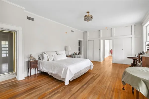 a bedroom with a bed and a table