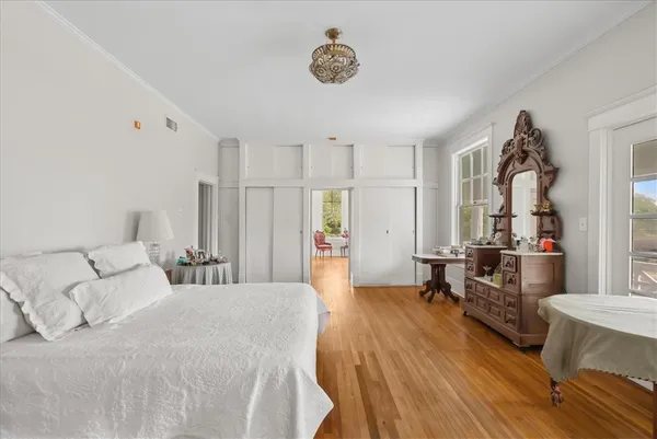 a bedroom with furniture and a window