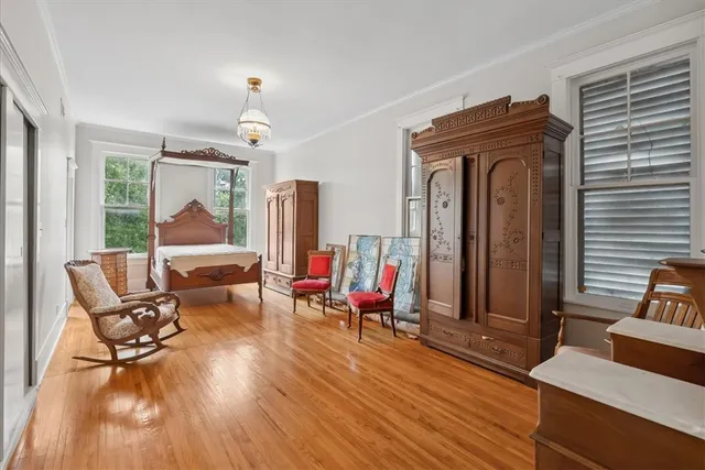 a bed room with a bed and a chandelier