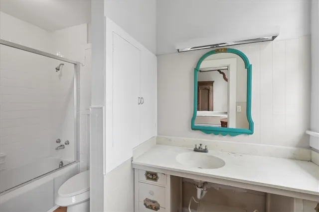 a bathroom with a sink and shower