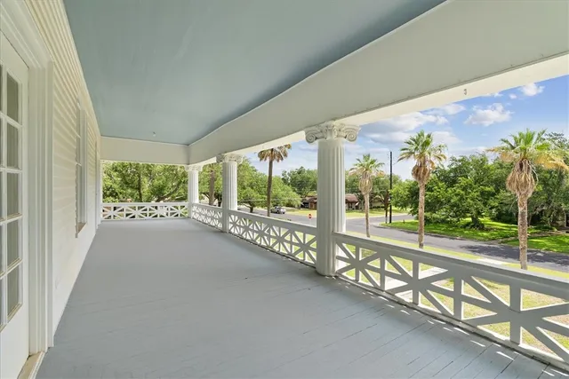 a view of a city street from a balcony