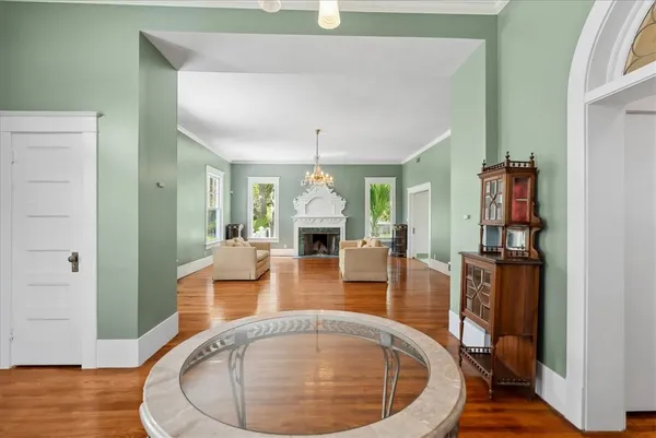 a view of a livingroom with furniture and wooden floor