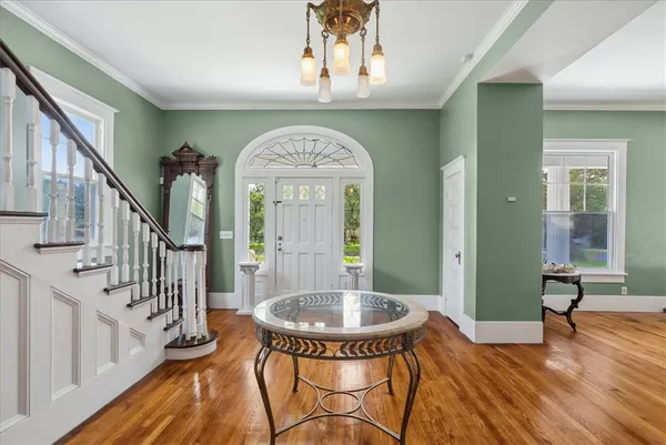 a view of a porch with furniture window and wooden floor