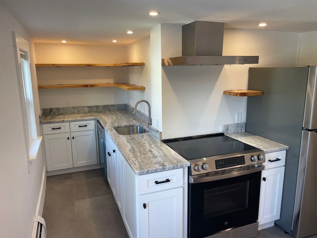 a kitchen with a stove and a sink