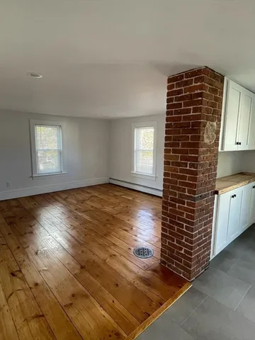 a view of empty room with windows