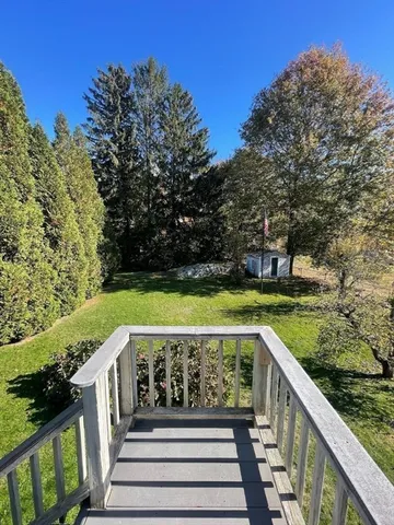 a view of balcony with yard