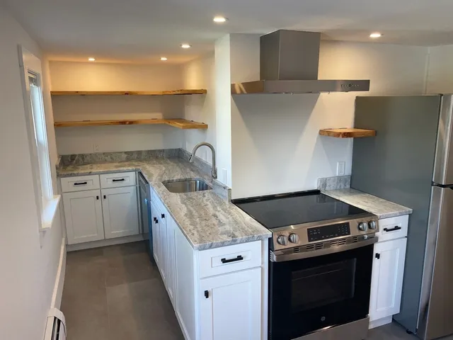 a kitchen with a stove and a sink