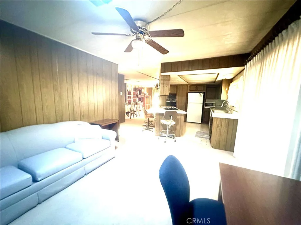 11250 Beach Stanton Ca, Unit 31 Stanton, CA 90680 - Photo 13 of 15 a living room with furniture and a large window