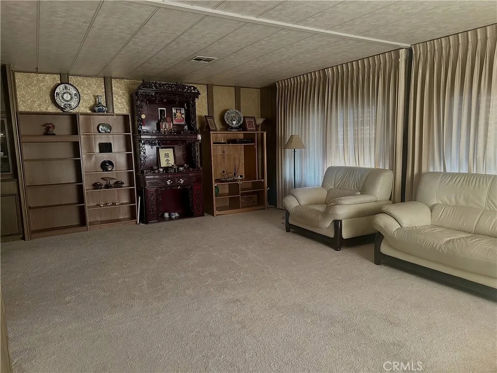11250 Beach Stanton Ca, Unit 31 Stanton, CA 90680 - Photo 3 of 15 a living room with furniture and a flat screen tv