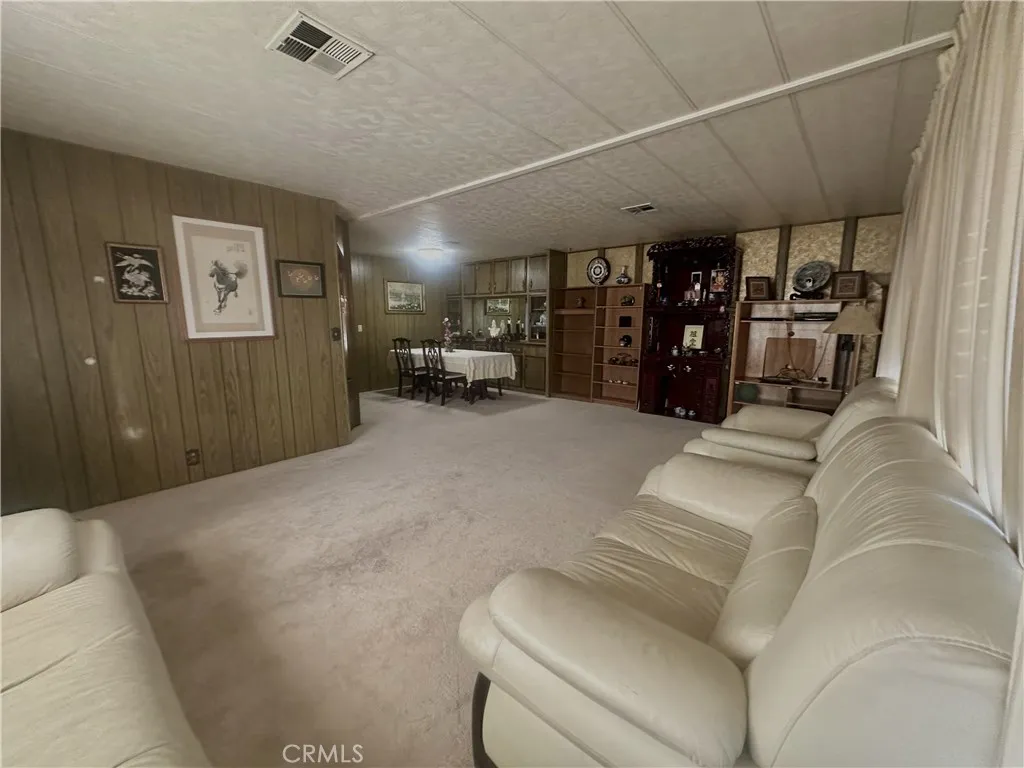 11250 Beach Stanton Ca, Unit 31 Stanton, CA 90680 - Photo 6 of 15 a living room with furniture and a large window