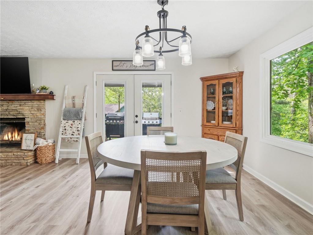 612 Beaver Ridge Road Jasper, GA 30143 - Photo 12 of 38 a view of a dining room with furniture window and wooden floor