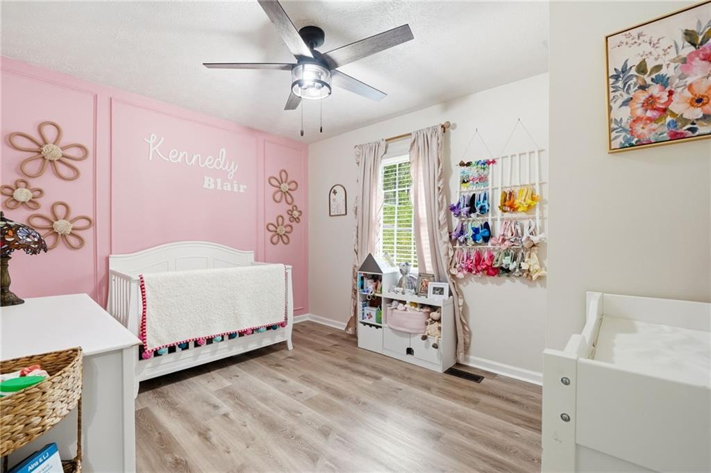 612 Beaver Ridge Road Jasper, GA 30143 - Photo 19 of 38 a bedroom with furniture and a baby crib
