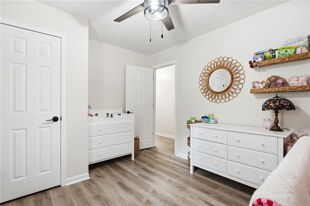 612 Beaver Ridge Road Jasper, GA 30143 - Photo 20 of 38 a room with a baby crib dryer and a chandelier