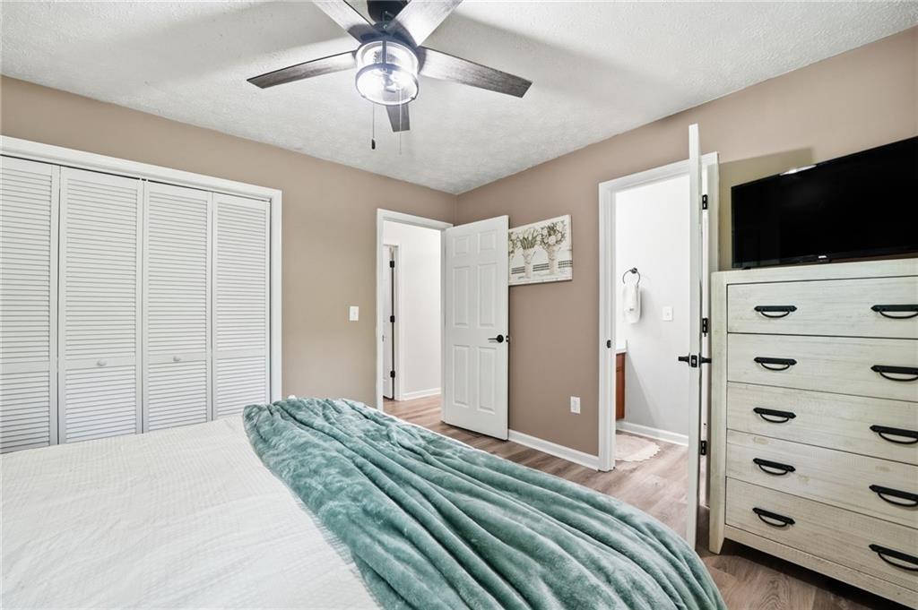 612 Beaver Ridge Road Jasper, GA 30143 - Photo 22 of 38 a bedroom with a bed and a flat screen tv