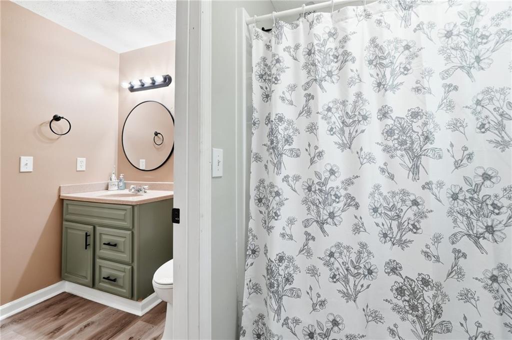 612 Beaver Ridge Road Jasper, GA 30143 - Photo 26 of 38 a bathroom with a sink and a mirror