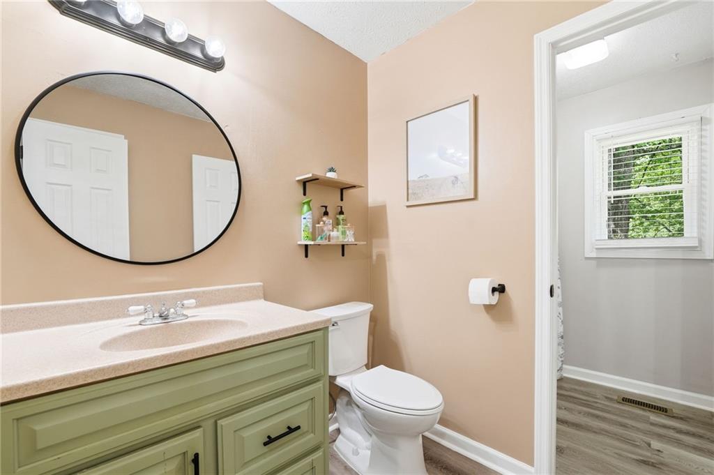 612 Beaver Ridge Road Jasper, GA 30143 - Photo 27 of 38 a bathroom with a sink and a mirror