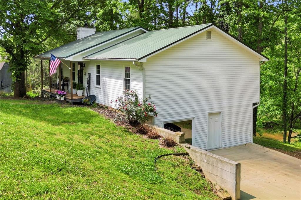 612 Beaver Ridge Road Jasper, GA 30143 - Photo 34 of 38 a view of a house with backyard and garden